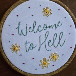 Charming Embroidered Wall Art with Floral Accents